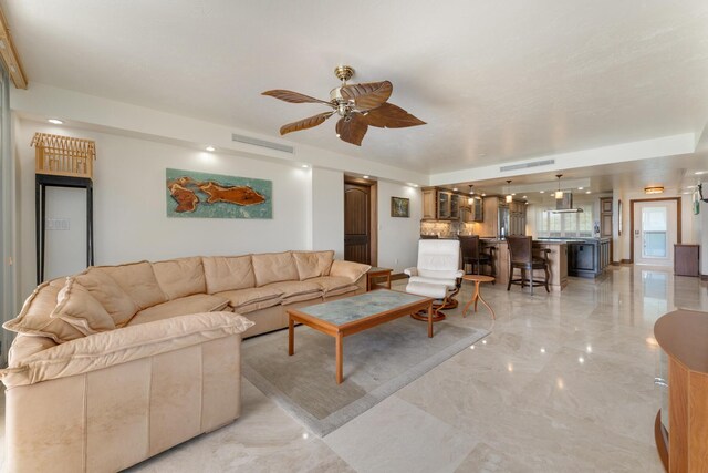 unfurnished living room featuring ceiling fan