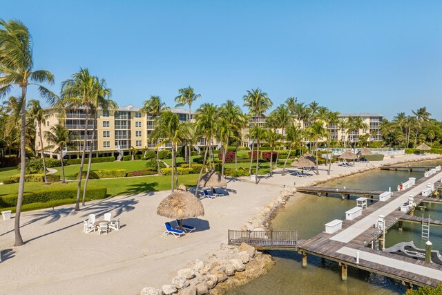 view of home's community featuring a water view and a dock