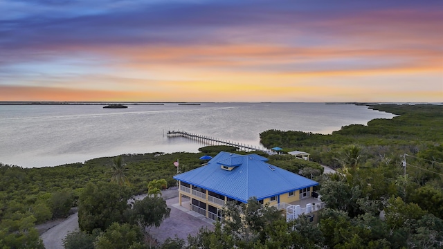 aerial view at dusk with a water view