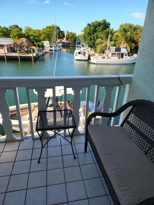 balcony featuring a water view