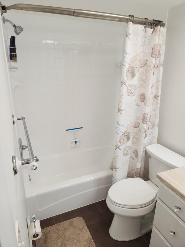 full bathroom featuring tile patterned flooring, vanity, shower / bath combination with curtain, and toilet