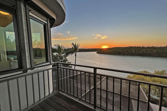 balcony at dusk with a water view