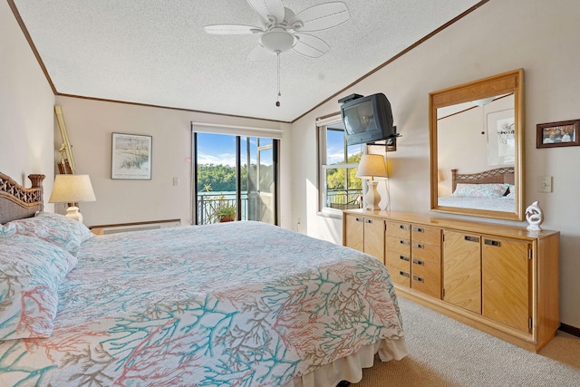 carpeted bedroom with lofted ceiling, a textured ceiling, ornamental molding, ceiling fan, and access to exterior