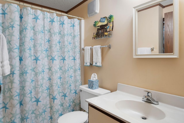 bathroom featuring a shower with curtain, vanity, a textured ceiling, and toilet