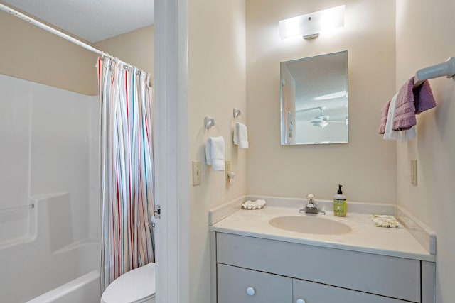 full bathroom with vanity, a textured ceiling, toilet, and shower / tub combo with curtain