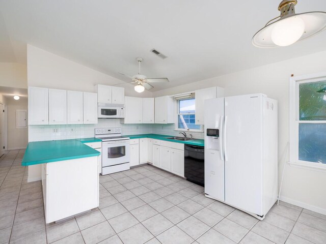 kitchen with white cabinets, white appliances, and decorative backsplash