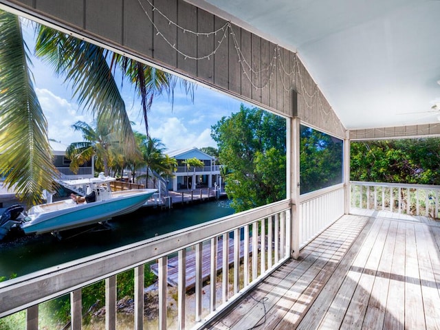 wooden deck featuring a water view