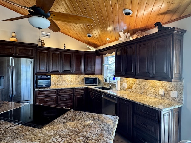 27821 Leeward S Rd, Little Torch, FL 33042 - kitchen with stainless steel appliances, wood ceiling, vaulted ceiling, backsplash, and light stone counters