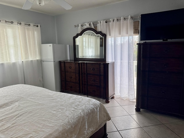 27821 Leeward S Rd, Little Torch, FL 33042 - bedroom with freestanding refrigerator, light tile patterned floors, and ceiling fan