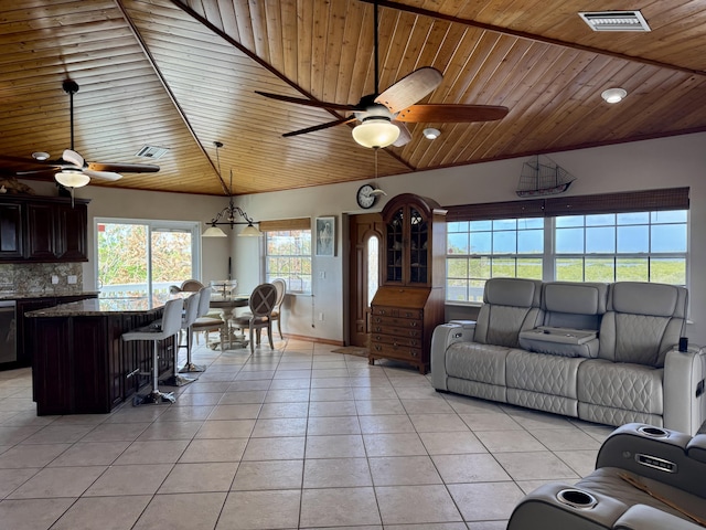 27821 Leeward S Rd, Little Torch, FL 33042 - living area featuring a ceiling fan, lofted ceiling, light tile patterned floors, and wood ceiling