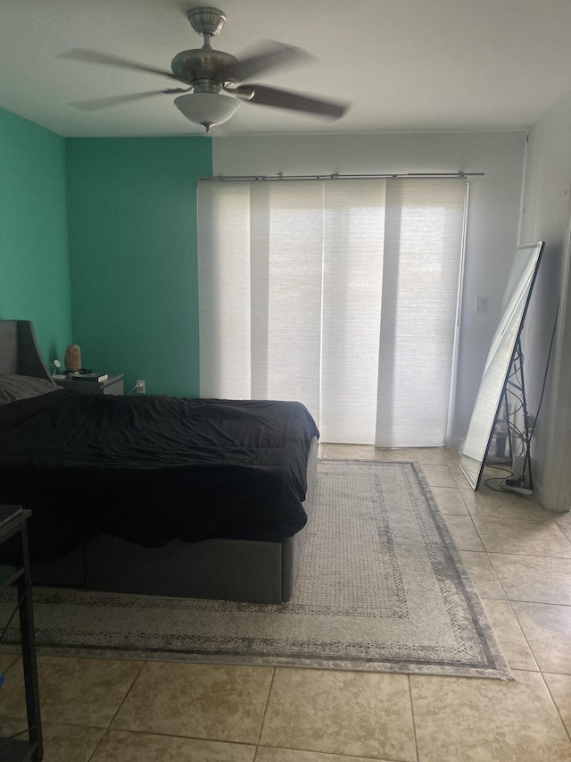 bedroom featuring tile patterned floors and ceiling fan