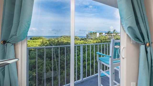 balcony featuring a water view