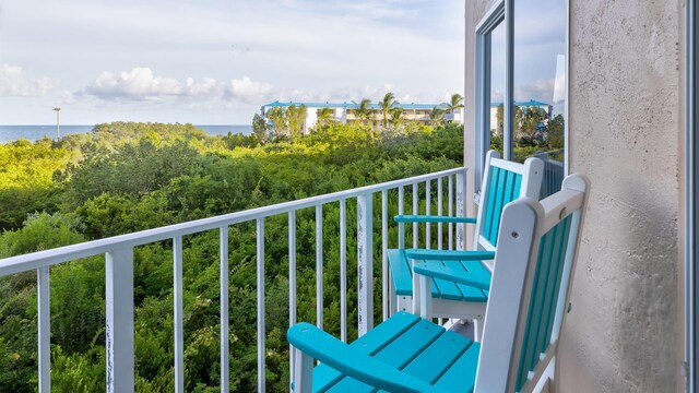 balcony featuring a water view