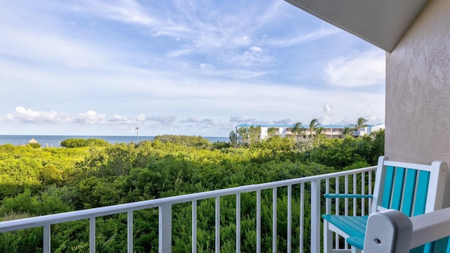 balcony featuring a water view