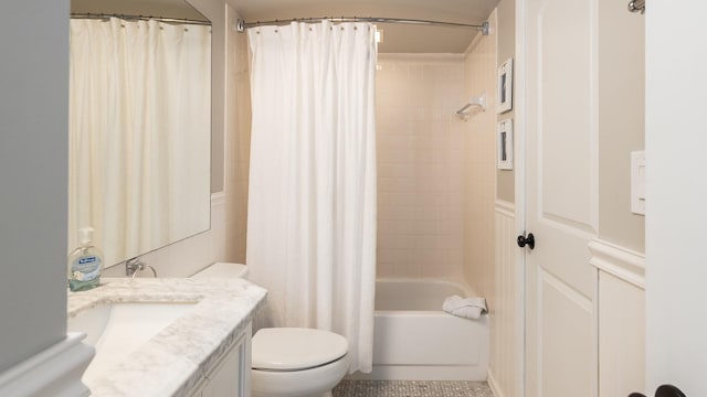 full bathroom featuring shower / tub combo with curtain, vanity, tile patterned flooring, and toilet