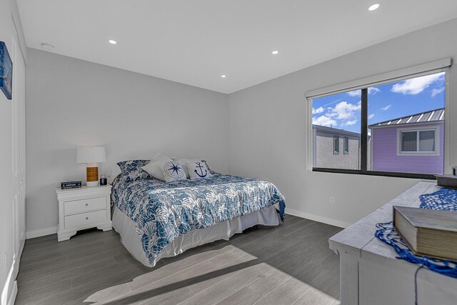 bedroom with wood-type flooring