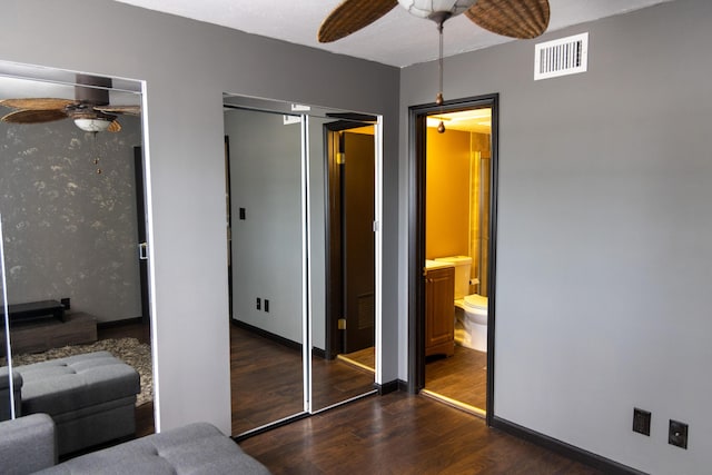 3355 Flagler Ave, Key West, FL 33040 - bedroom with multiple closets, wood finished floors, a ceiling fan, and connected bathroom