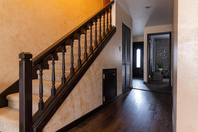 3355 Flagler Ave, Key West, FL 33040 - stairway with wood finished floors and a textured wall