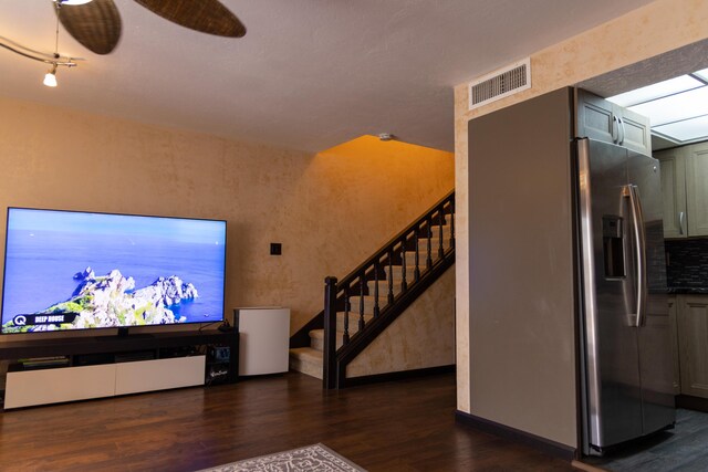 3355 Flagler Ave, Key West, FL 33040 - living room with dark wood-style flooring, stairs, baseboards, and a ceiling fan