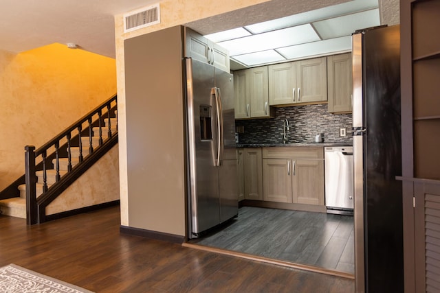 3355 Flagler Ave, Key West, FL 33040 - kitchen featuring stainless steel appliances, dark wood-type flooring, a sink, and backsplash
