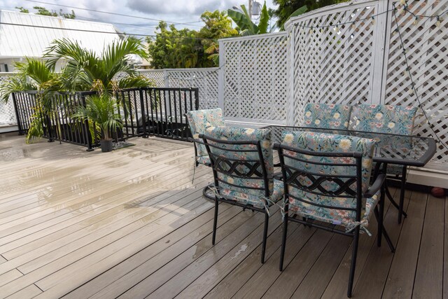 3355 Flagler Ave, Key West, FL 33040 - wooden deck with outdoor dining space