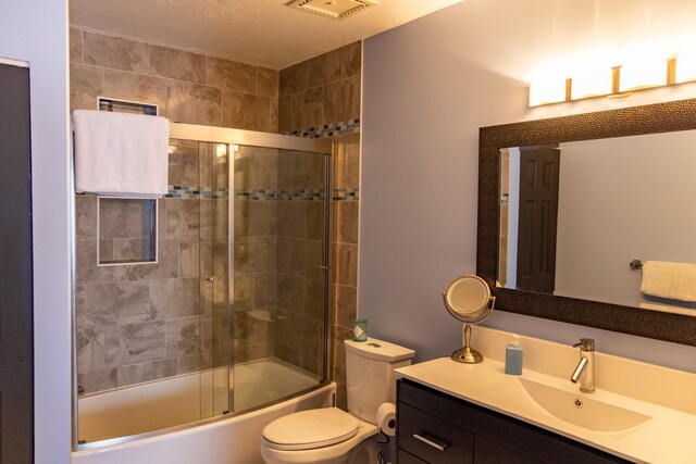 3355 Flagler Ave, Key West, FL 33040 - full bathroom with toilet, vanity, and shower / bath combination with glass door
