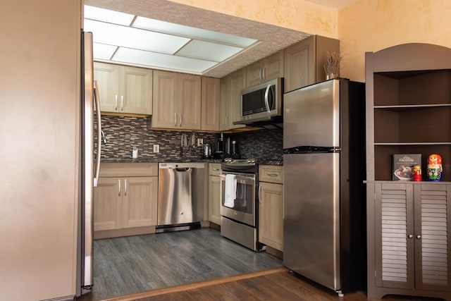 3355 Flagler Ave, Key West, FL 33040 - kitchen with stainless steel appliances, dark countertops, tasteful backsplash, and dark wood-type flooring