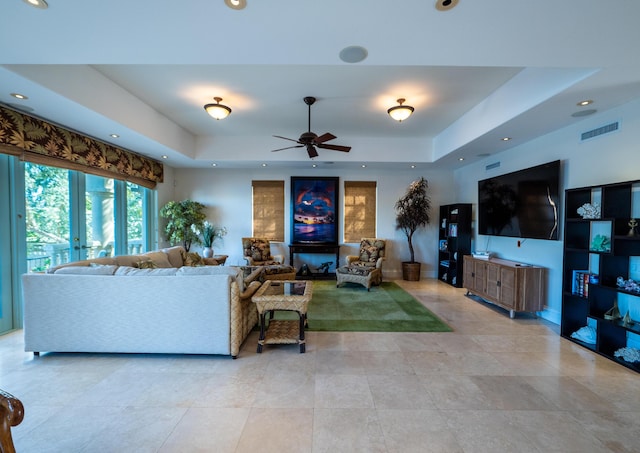 33 Cypress Ave, Key Haven, FL 33040 - living room with a tray ceiling, a ceiling fan, and recessed lighting
