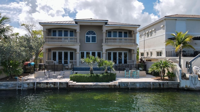 33 Cypress Ave, Key Haven, FL 33040 - rear view of property with french doors, a balcony, and a patio
