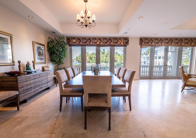 33 Cypress Ave, Key Haven, FL 33040 - dining space featuring a tray ceiling, a chandelier, recessed lighting, and light tile patterned flooring