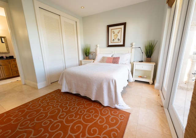 33 Cypress Ave, Key Haven, FL 33040 - bedroom featuring light tile patterned floors, a closet, and recessed lighting