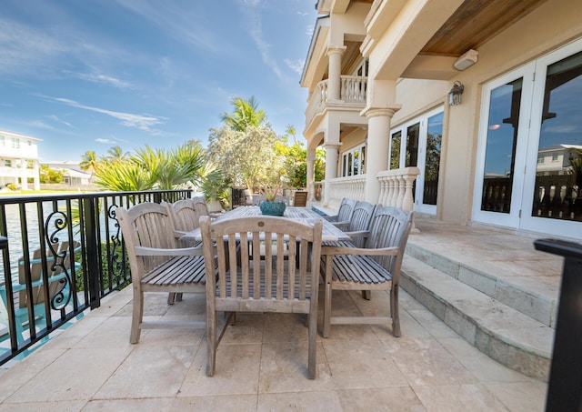 33 Cypress Ave, Key Haven, FL 33040 - patio / terrace with outdoor dining area and french doors