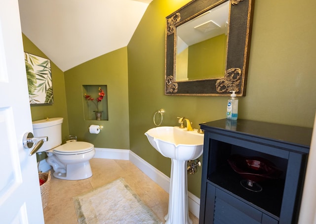 33 Cypress Ave, Key Haven, FL 33040 - bathroom with vaulted ceiling and tile patterned floors