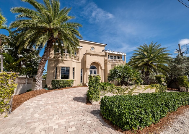 33 Cypress Ave, Key Haven, FL 33040 - mediterranean / spanish house featuring a balcony, stucco siding, and decorative driveway