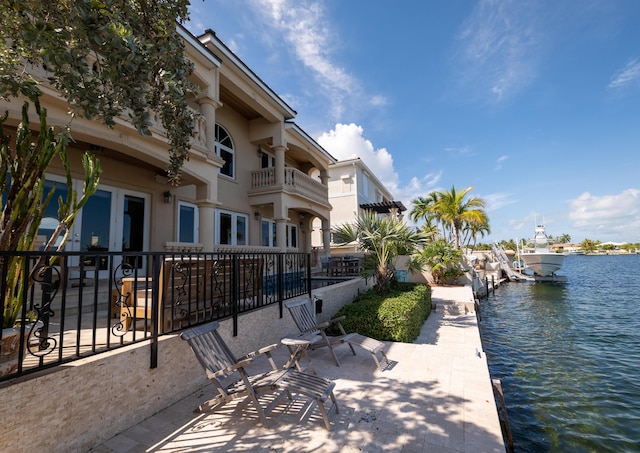 33 Cypress Ave, Key Haven, FL 33040 - view of home's community with a water view and a dock