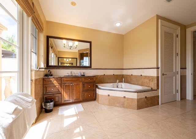 33 Cypress Ave, Key Haven, FL 33040 - full bathroom with vanity, a bath, a chandelier, a closet, and tile patterned floors