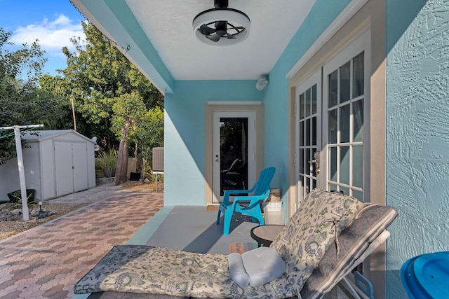 view of patio / terrace featuring an outbuilding and a storage unit