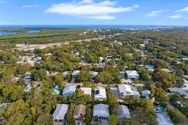 birds eye view of property featuring a residential view and a water view