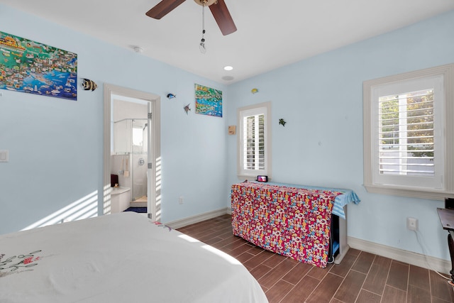 bedroom featuring a ceiling fan, baseboards, and wood tiled floor