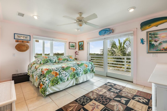 bedroom featuring multiple windows, crown molding, and access to outside