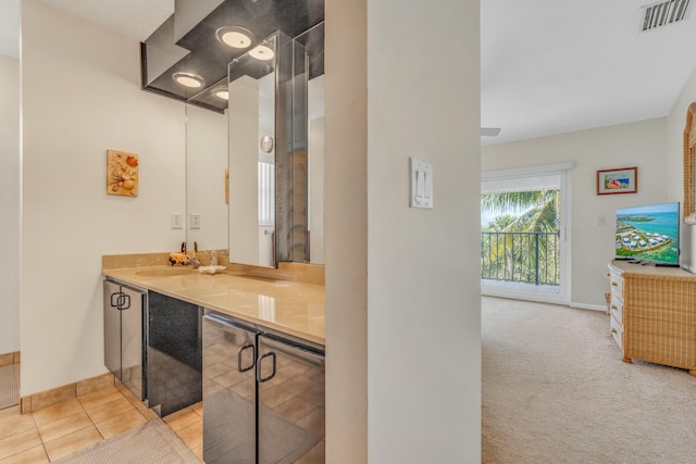 12690 Overseas Hwy Unit 52, Marathon, FL 33050 - bathroom featuring baseboards, visible vents, tile patterned flooring, and vanity