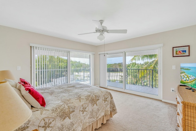 12690 Overseas Hwy Unit 52, Marathon, FL 33050 - carpeted bedroom featuring baseboards, access to outside, and ceiling fan