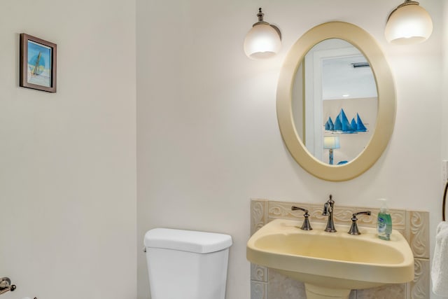 12690 Overseas Hwy Unit 52, Marathon, FL 33050 - half bathroom featuring toilet and a sink