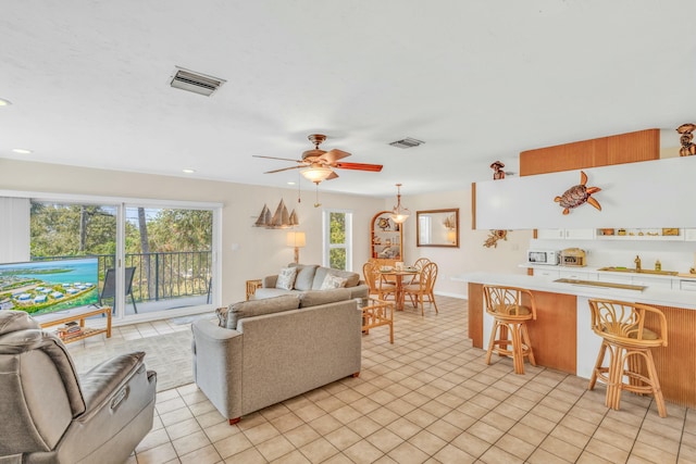 12690 Overseas Hwy Unit 52, Marathon, FL 33050 - living room featuring a ceiling fan, recessed lighting, light tile patterned floors, and visible vents