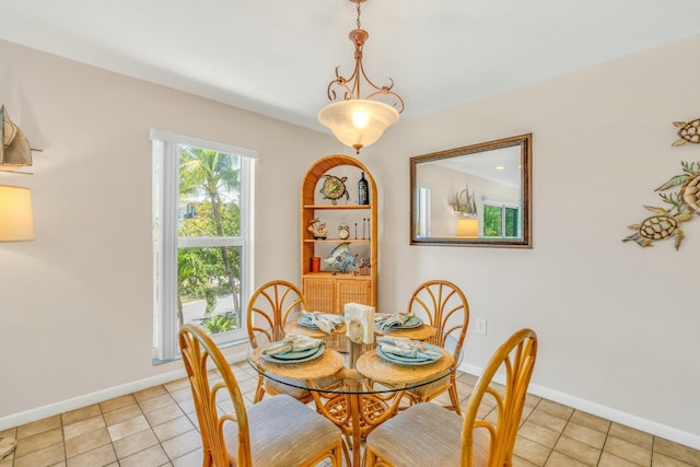 12690 Overseas Hwy Unit 52, Marathon, FL 33050 - dining area with light tile patterned flooring and baseboards