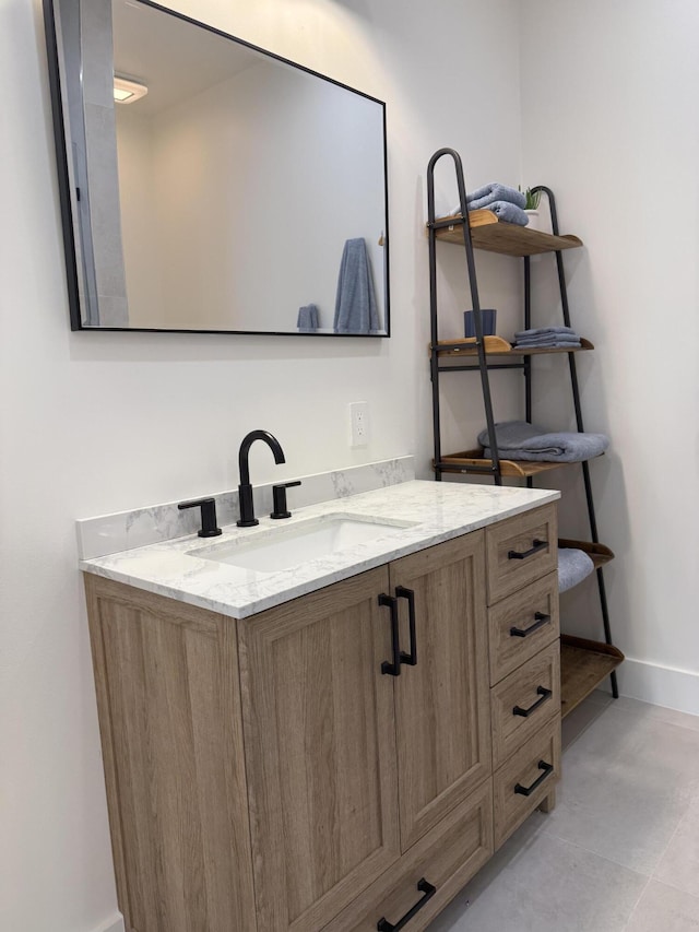 bathroom featuring vanity and baseboards