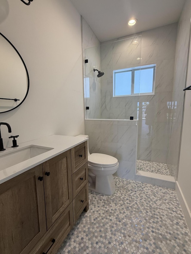 full bathroom with vanity, toilet, recessed lighting, and a marble finish shower