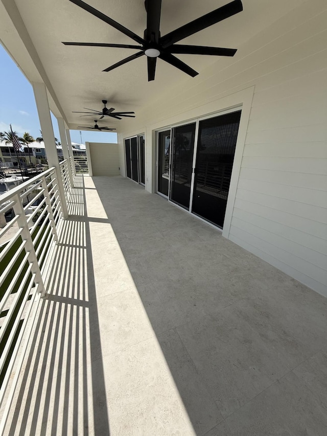 view of patio / terrace featuring a balcony and a ceiling fan