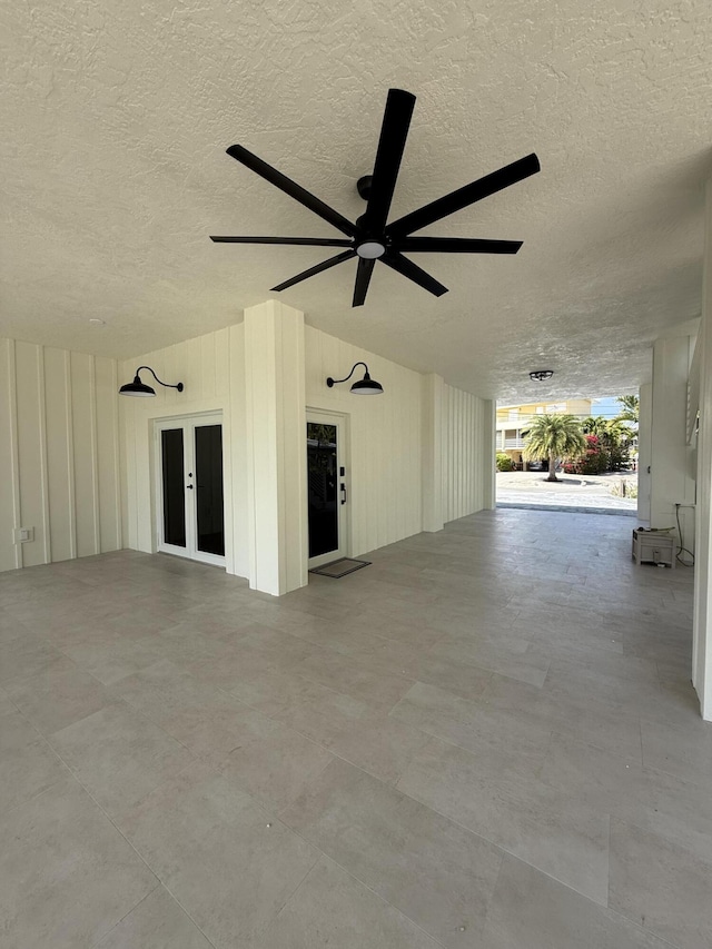 exterior space with french doors and ceiling fan