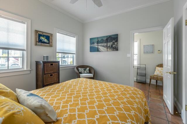 bedroom featuring ornamental molding, tile patterned floors, and ceiling fan